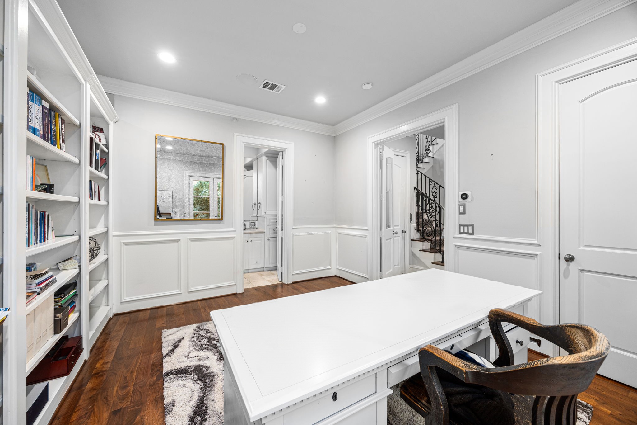 1723 Sunset Boulevard Houston, TX 77005 - Photo 6 of 50 This flexible first-floor office includes a closet and en-suite full bath, making it ideal for guests, a secondary bedroom, or a private study. This photo has been virtually staged.