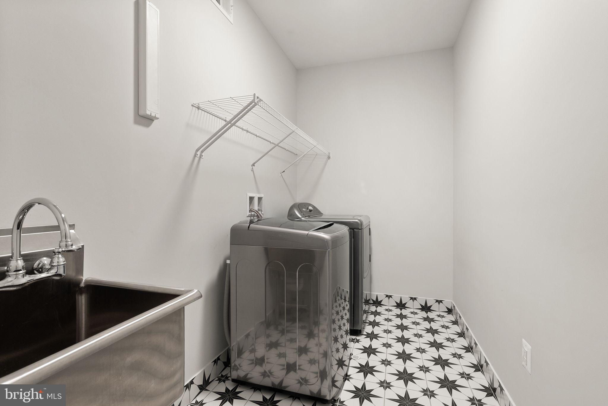 7101 27th Road North Arlington, VA 22213 - Photo 36 of 51 2nd floor laundry room. Designer tile.