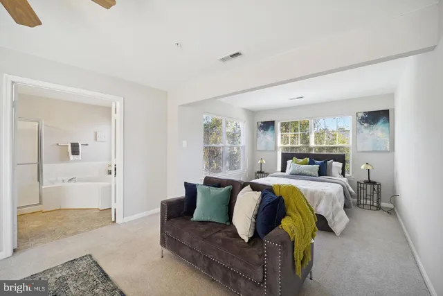 a bed room with bed and mirror