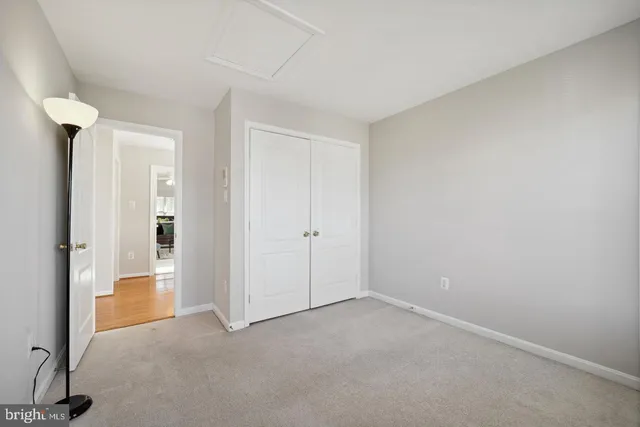 a view of an empty room and a window