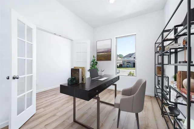 a dining room with furniture and wooden floor