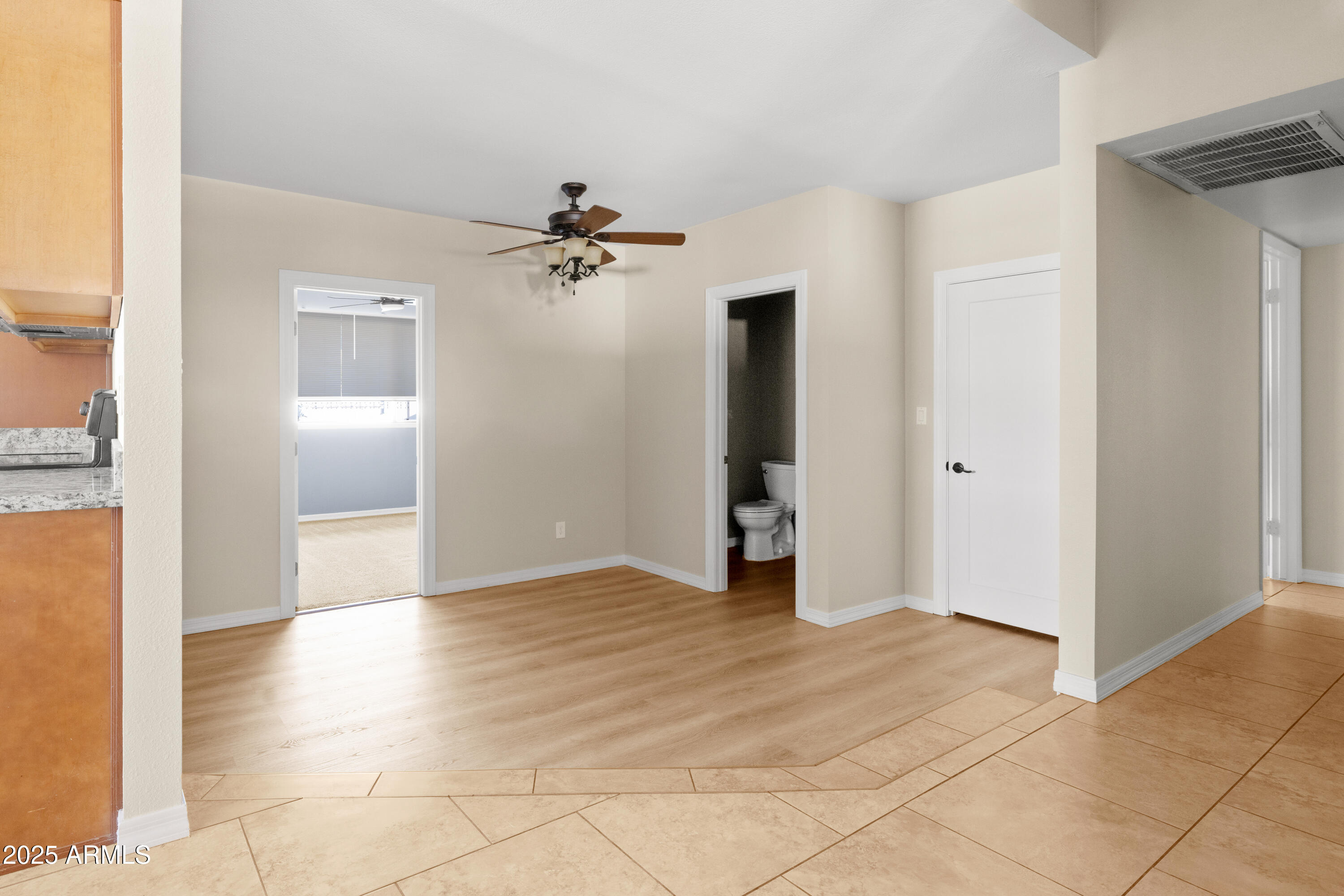 2715 South Rita Lane Tempe, AZ 85282 - Photo 14 of 30 a view of an empty room with closet and a window