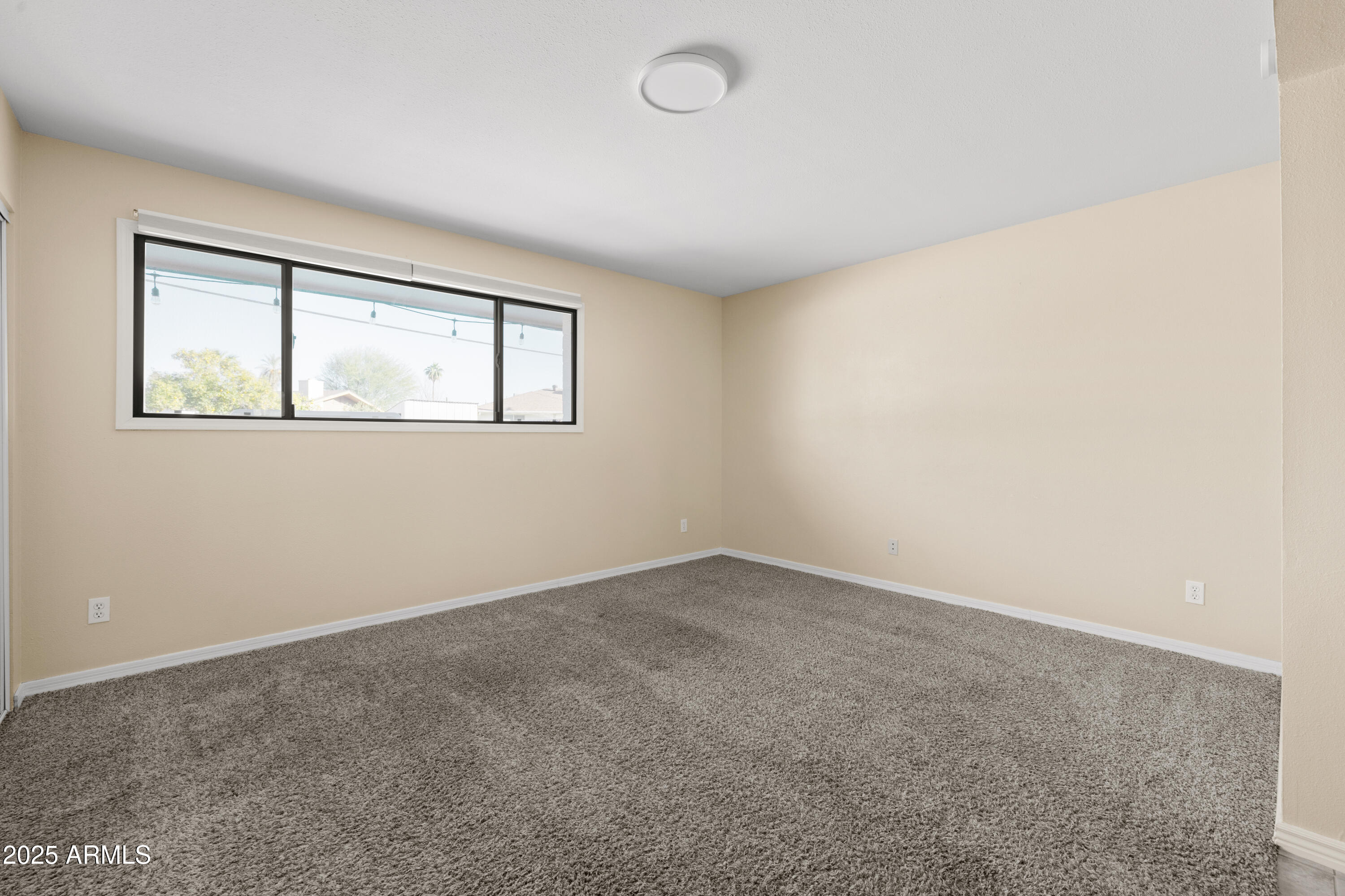 2715 South Rita Lane Tempe, AZ 85282 - Photo 19 of 30 an empty room with windows
