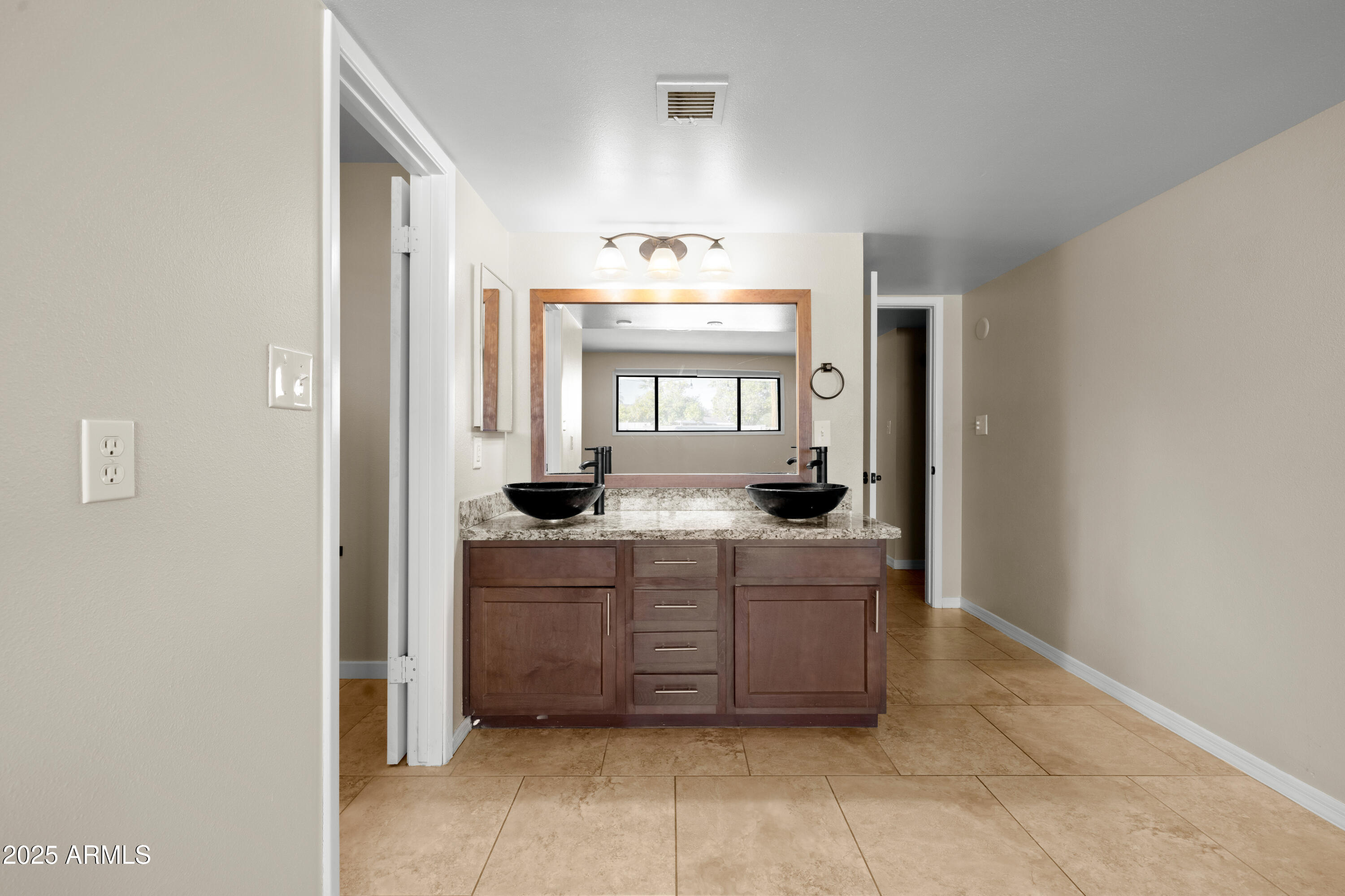 2715 South Rita Lane Tempe, AZ 85282 - Photo 20 of 30 a bathroom with a sink and a mirror