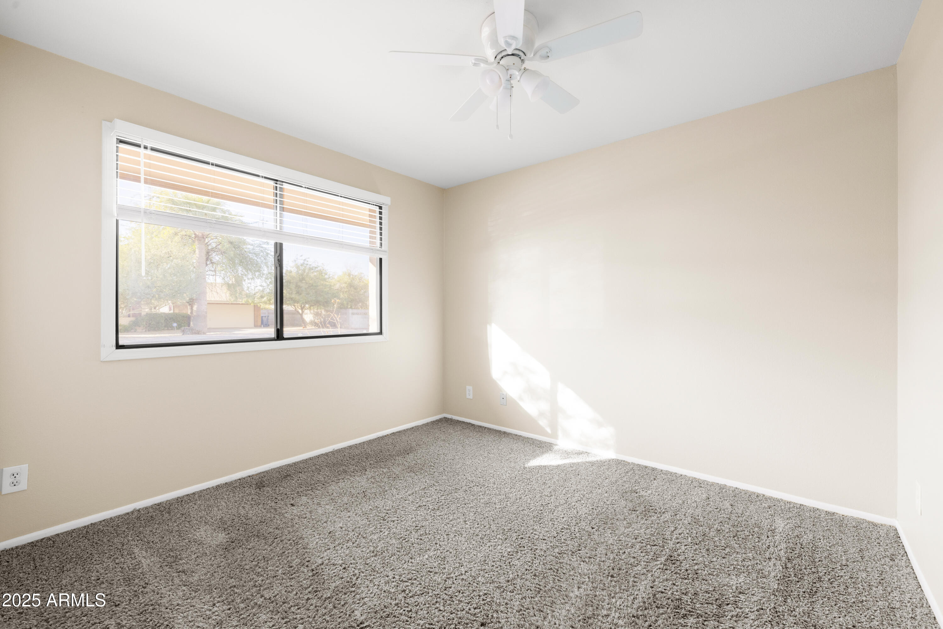 2715 South Rita Lane Tempe, AZ 85282 - Photo 22 of 30 a view of an empty room with a window