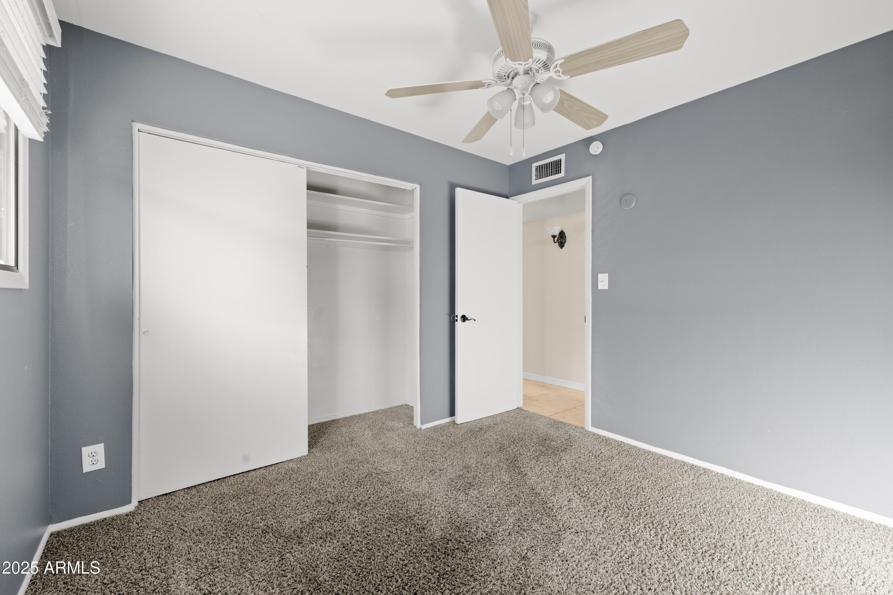 2715 South Rita Lane Tempe, AZ 85282 - Photo 27 of 30 a view of a livingroom with a ceiling fan