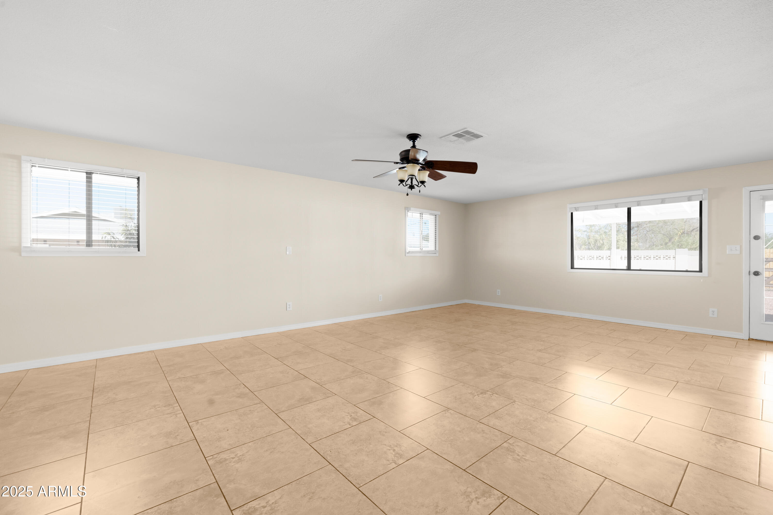 2715 South Rita Lane Tempe, AZ 85282 - Photo 4 of 30 a view of an empty room with a window