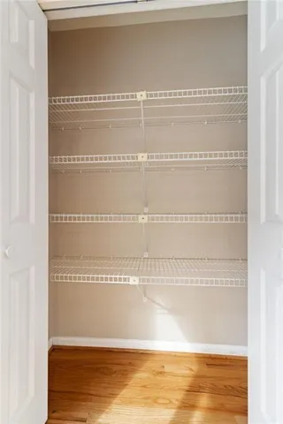 a view of a refrigerator with wooden floor