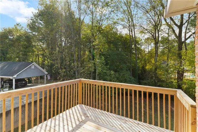 a balcony with trees in front of it
