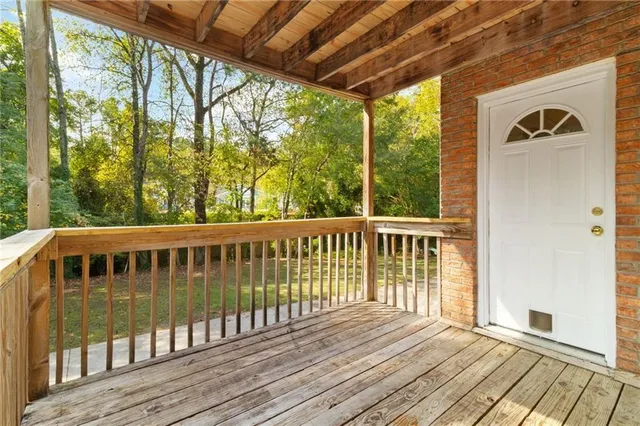 a view of a wooden chairs on the deck