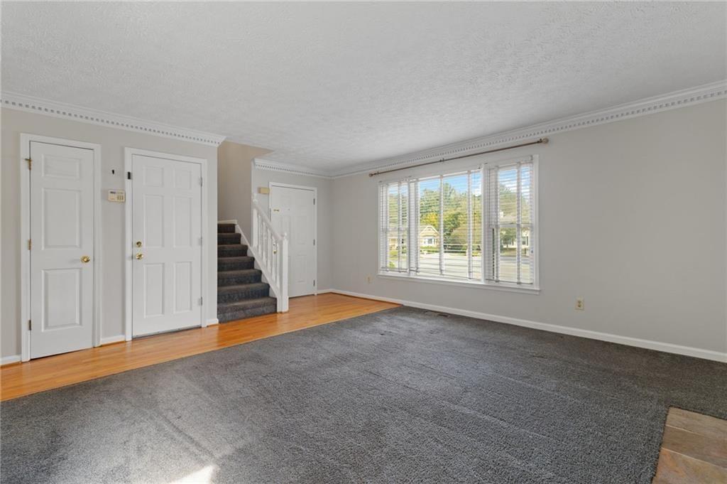 650 Corbin Lake Court Atlanta, GA 30350 - Photo 9 of 42 an empty room with windows