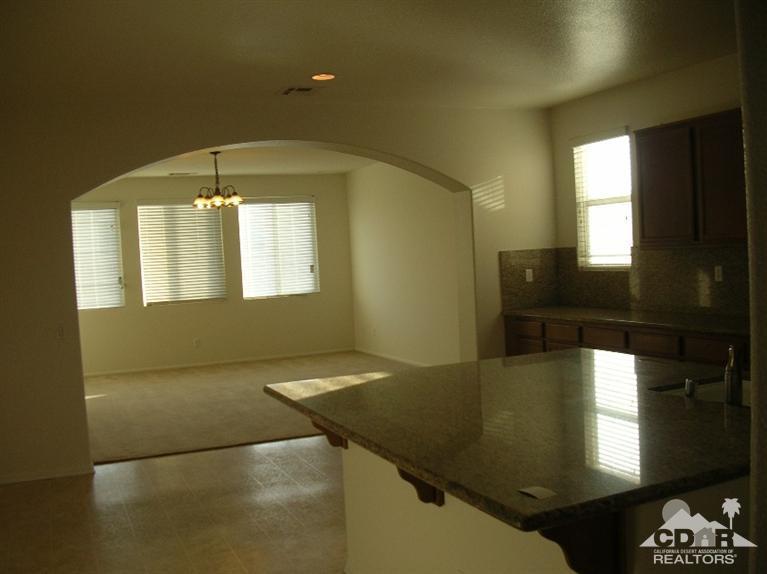 82797 Mount Riley Drive Indio, CA 92203 - Photo 4 of 17 a view of an empty room and window