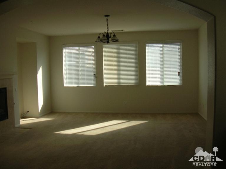 82797 Mount Riley Drive Indio, CA 92203 - Photo 5 of 17 an empty room with windows