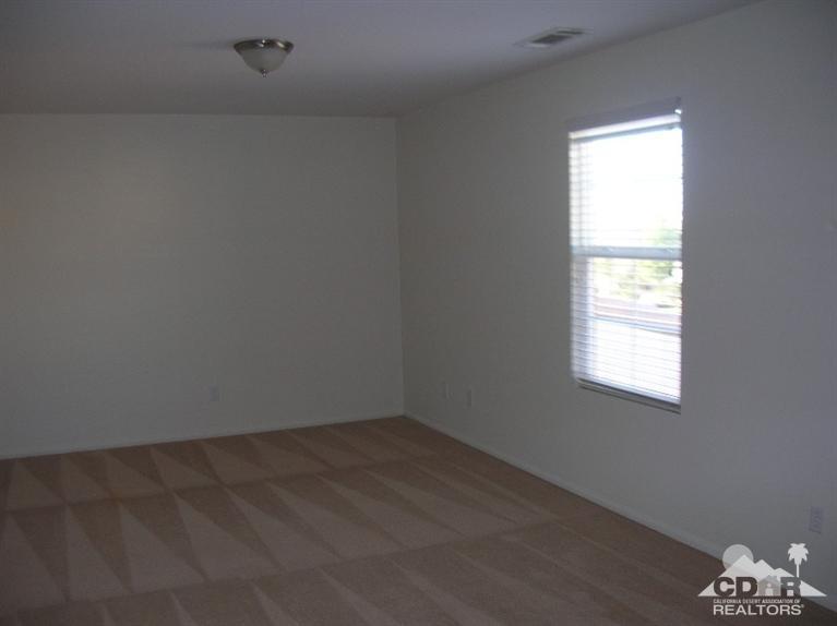 82797 Mount Riley Drive Indio, CA 92203 - Photo 10 of 17 an empty room with a window