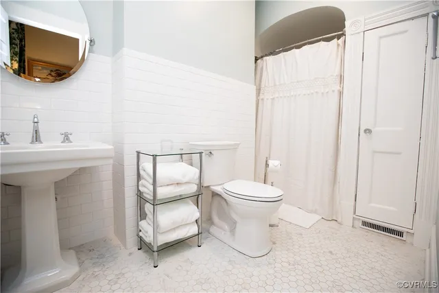 a bedroom with a bed and a cabinets