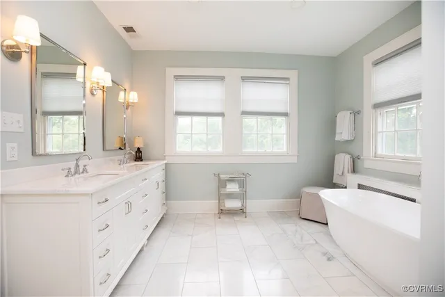 a spacious bathroom with a bathtub and shower