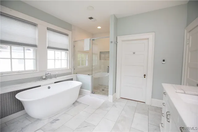 a bathroom with a sink double vanity and a mirror