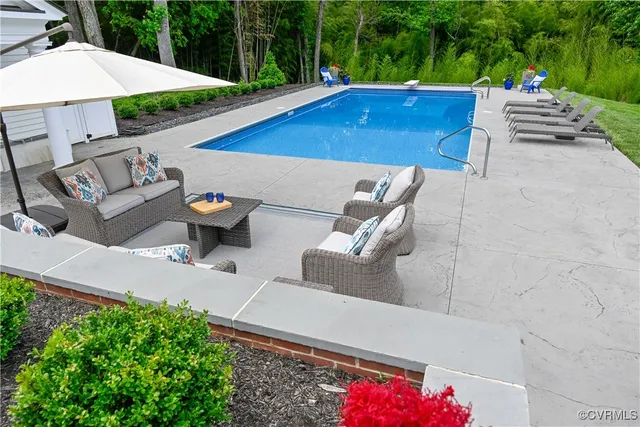 a view of a patio with a table and chairs