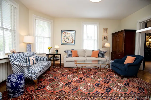 a living room with furniture and a fireplace