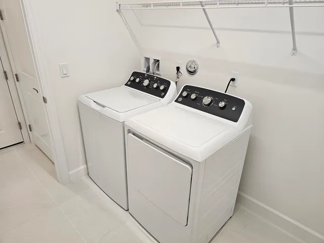 a utility room with dryer and washer