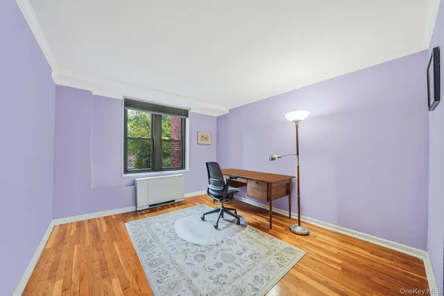 a bed room with a bed and a chair