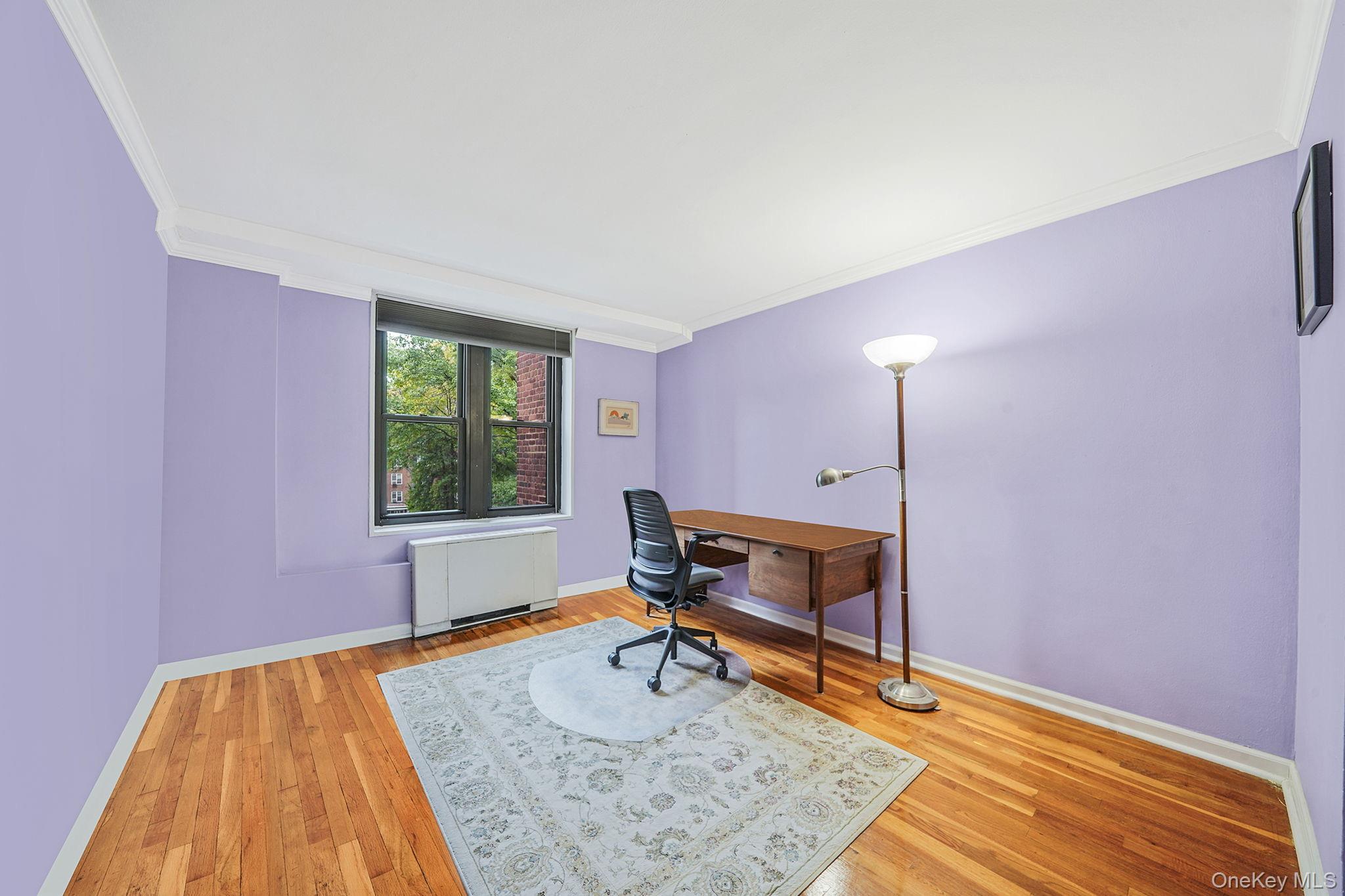 18-35 Corporal Kennedy Street, Unit 2B Queens, NY 11360 - Photo 13 of 25 a bedroom with a bed and a window