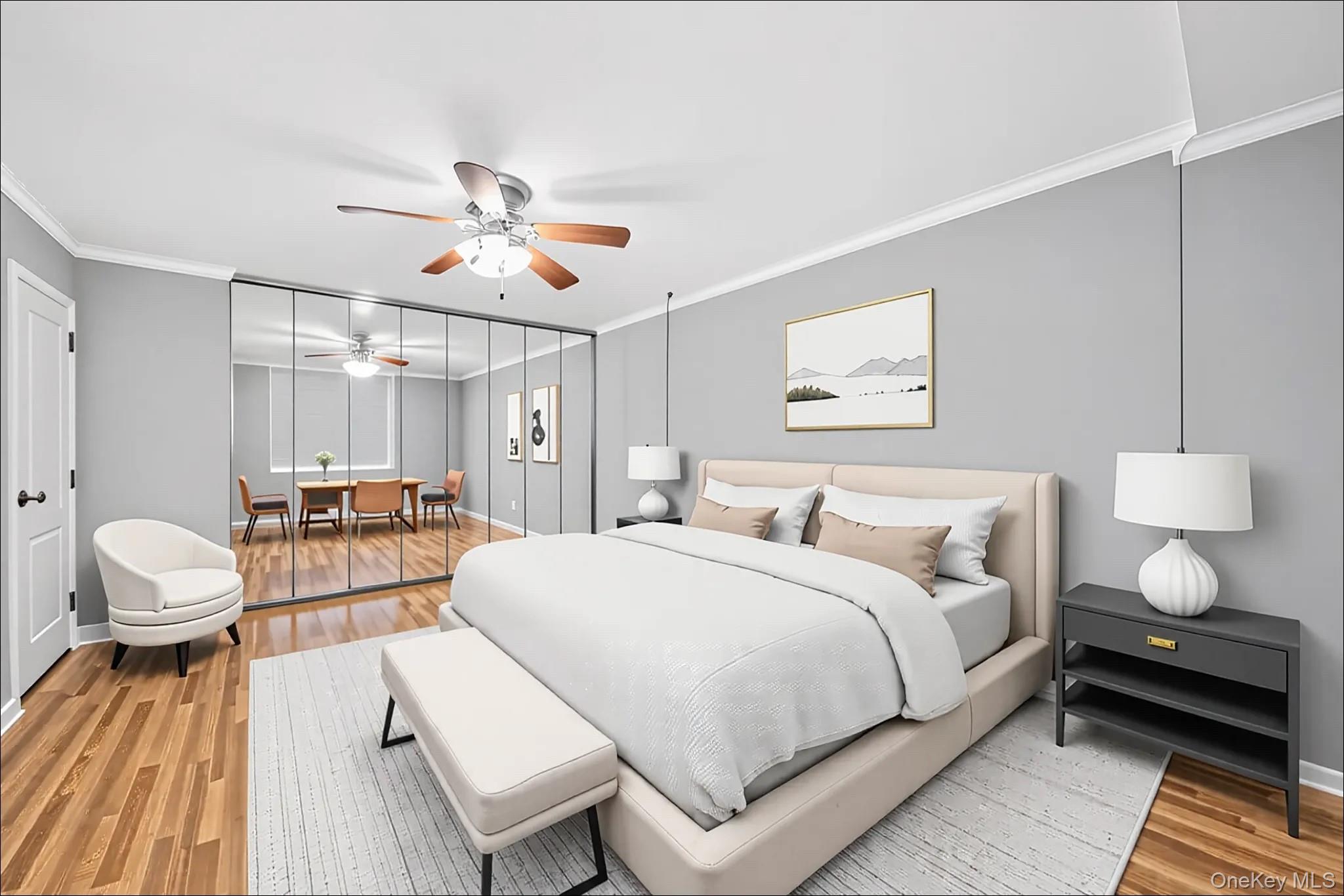 18-35 Corporal Kennedy Street, Unit 2B Queens, NY 11360 - Photo 15 of 25 a bedroom with a bed and a chandelier