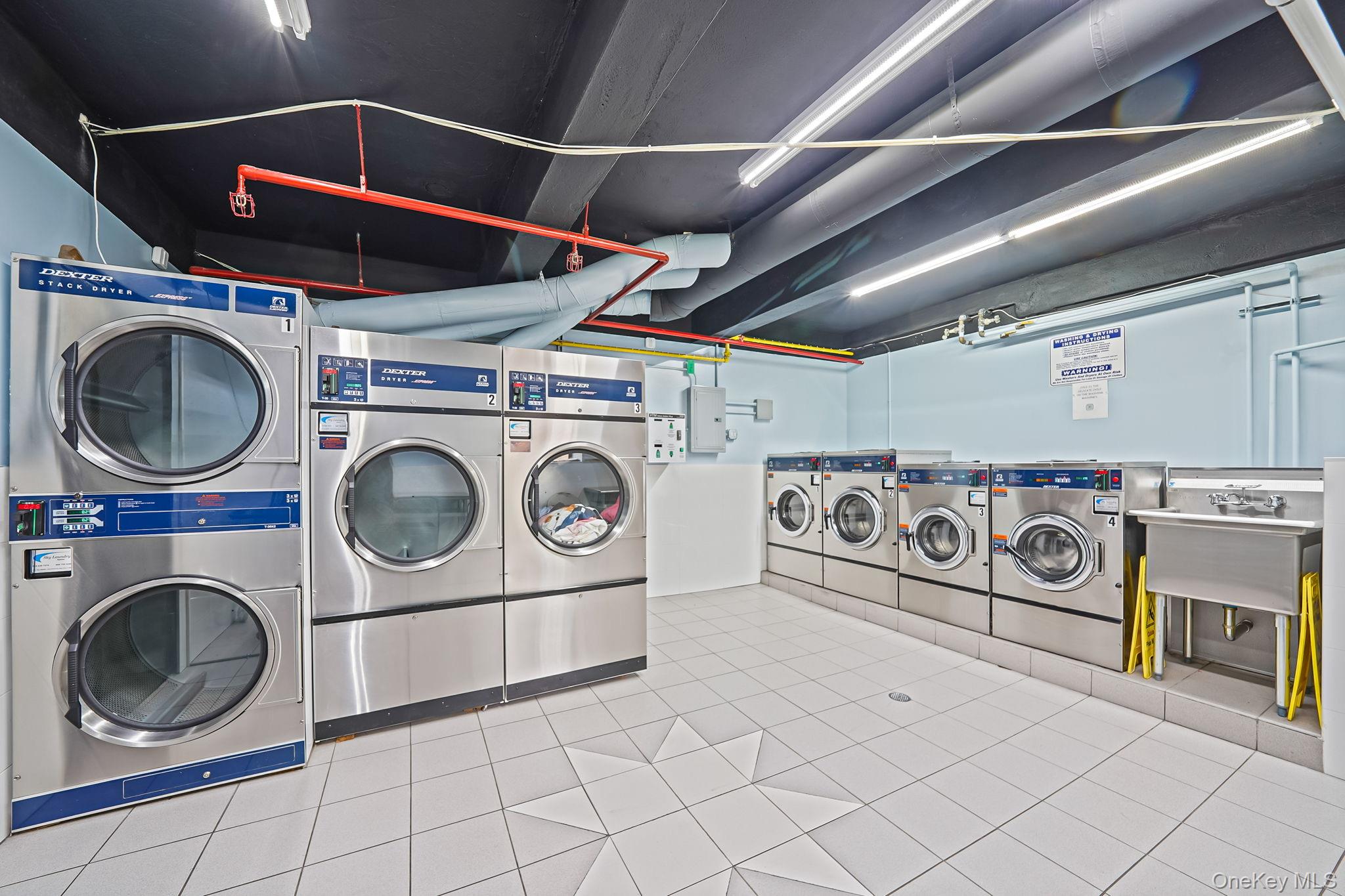 18-35 Corporal Kennedy Street, Unit 2B Queens, NY 11360 - Photo 20 of 25 a utility room with dryer washer and stair