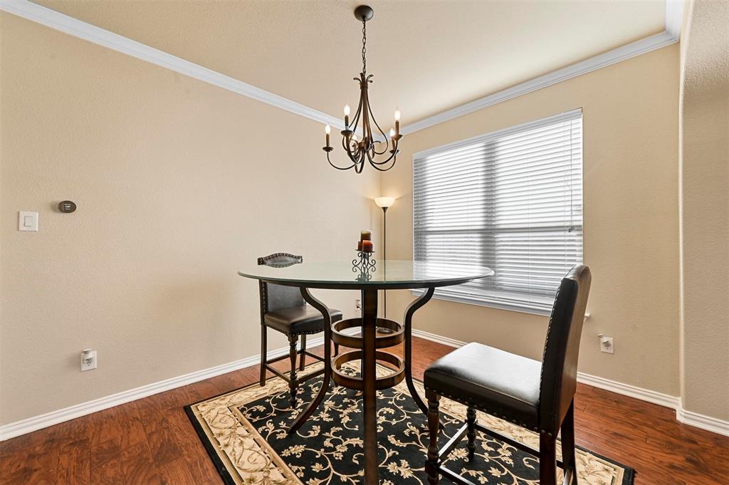 14815 Frisco Ranch Drive Little Elm, TX 75068 - Photo 7 of 40 a dining room with a table and chairs