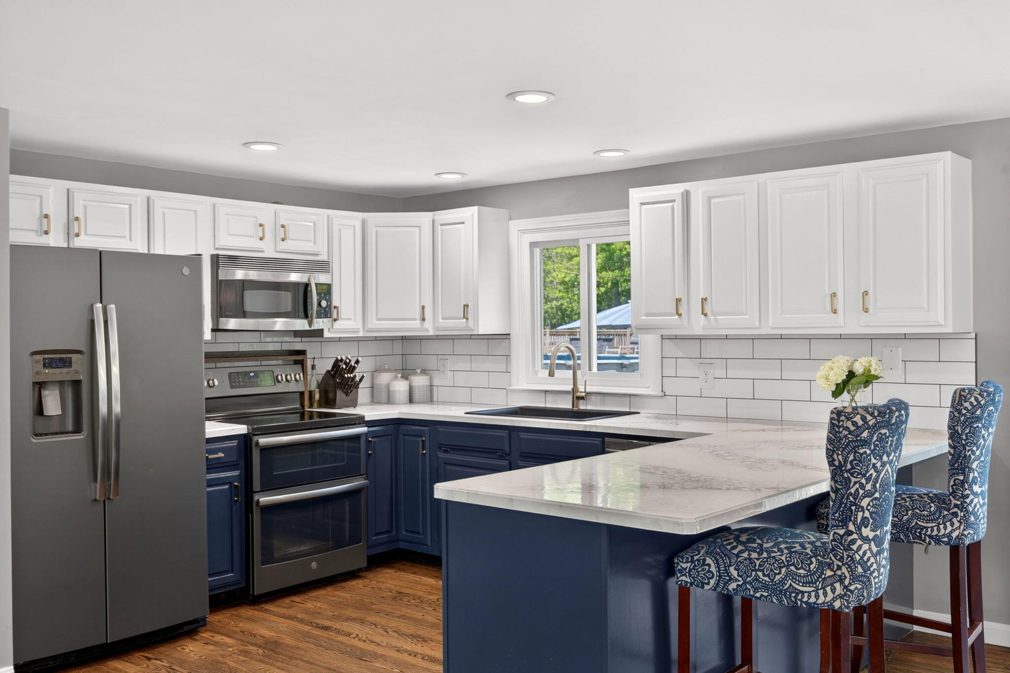 12 Sarah Lawrence Road Sandwich, MA 02563 - Photo 2 of 54 a kitchen with granite countertop kitchen island stainless steel appliances a stove refrigerator sink and cabinets