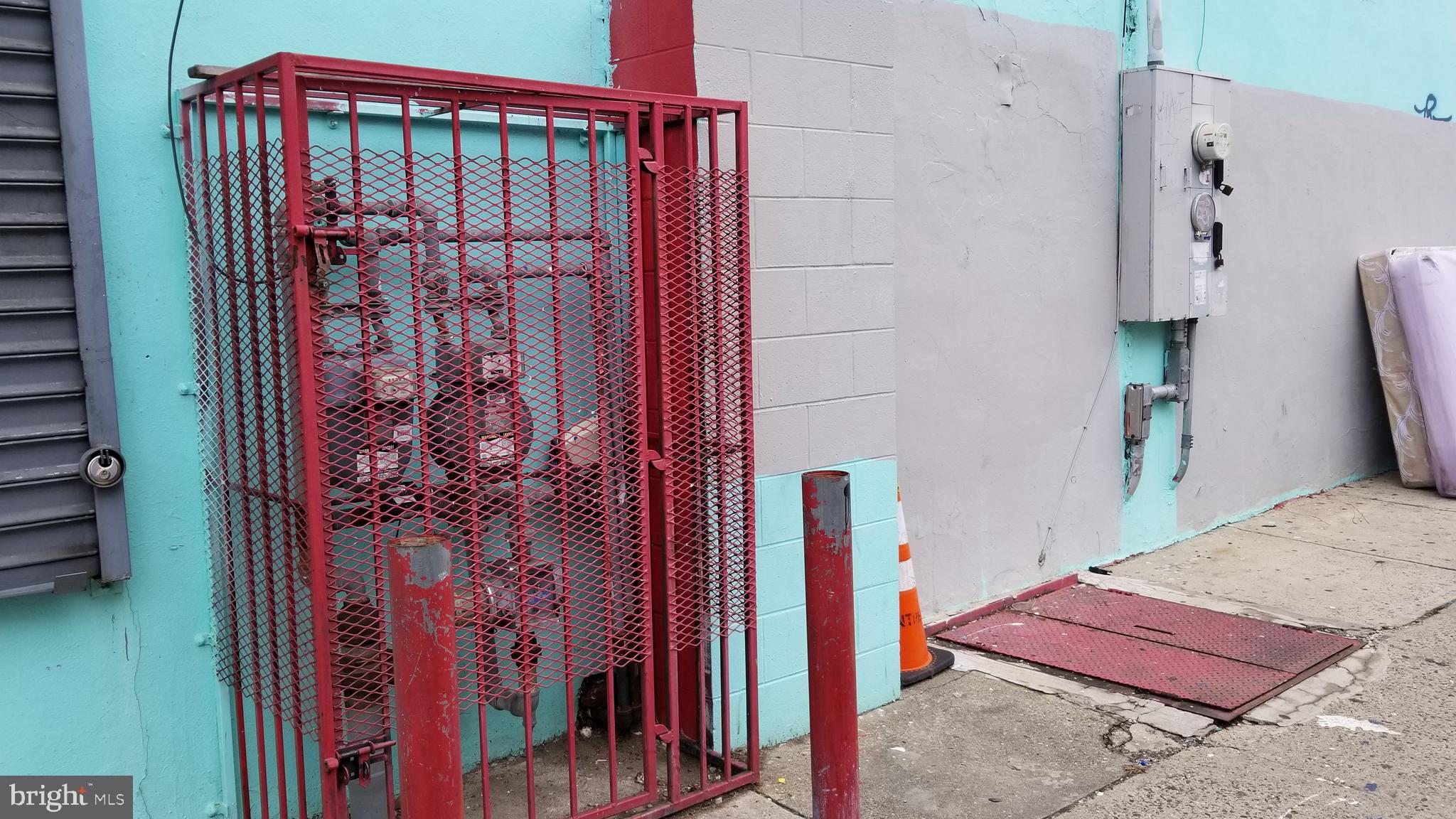 3401 North Front Street Philadelphia, PA 19140 - Photo 8 of 9 a bedroom with a bed and a book shelf