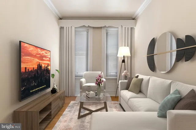 a living room with furniture a flat screen tv and a large window