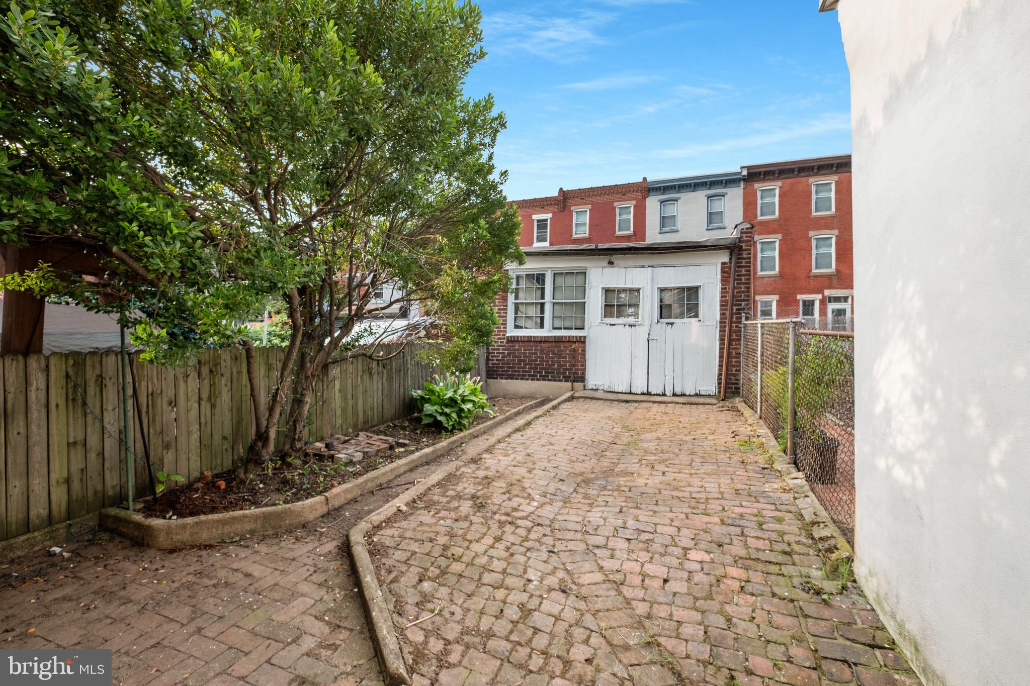 2433 Fairmount Avenue, Unit 1 Philadelphia, PA 19130 - Photo 11 of 13 front view of a house with a garden
