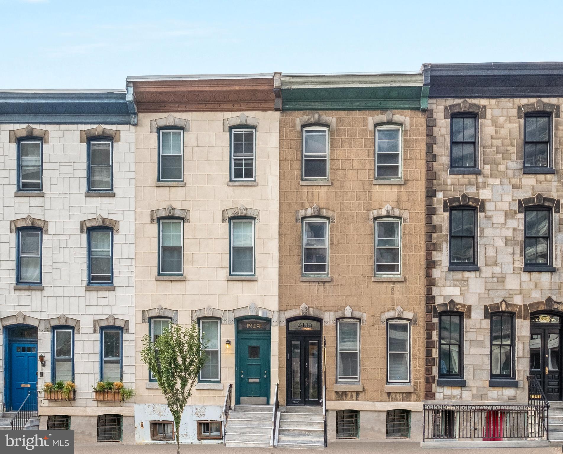 2433 Fairmount Avenue, Unit 1 Philadelphia, PA 19130 - Photo 12 of 13 a view of a building next to a yard