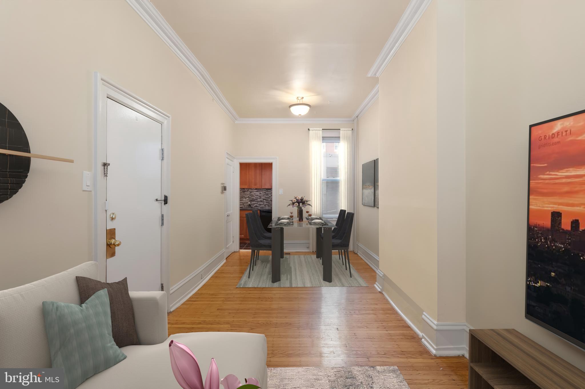 2433 Fairmount Avenue, Unit 1 Philadelphia, PA 19130 - Photo 2 of 13 a living room with furniture and a table