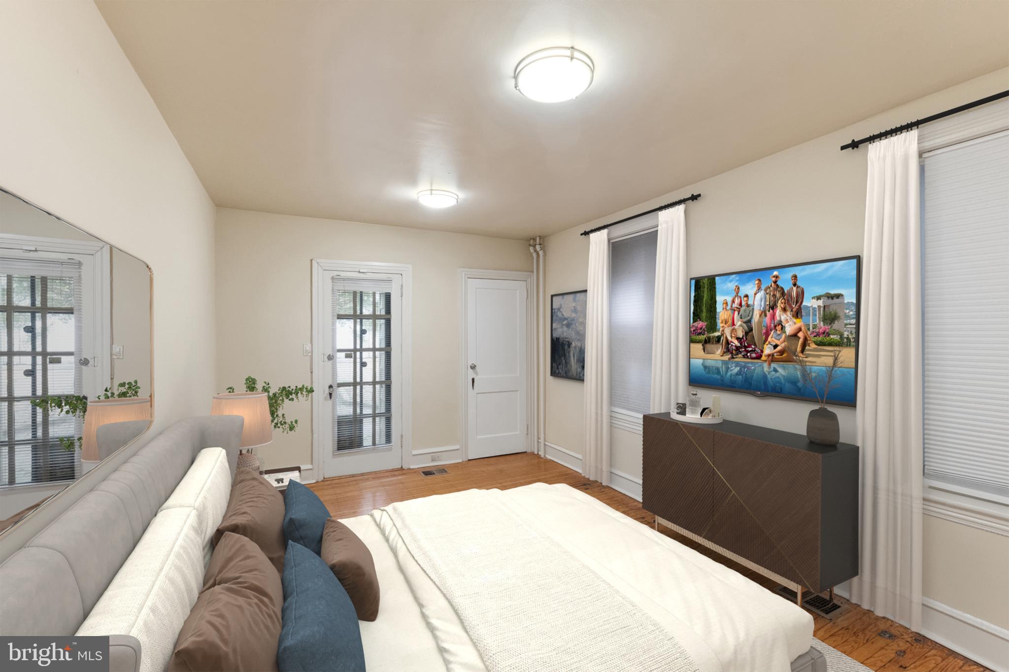 2433 Fairmount Avenue, Unit 1 Philadelphia, PA 19130 - Photo 7 of 13 a living room with furniture and a flat screen tv