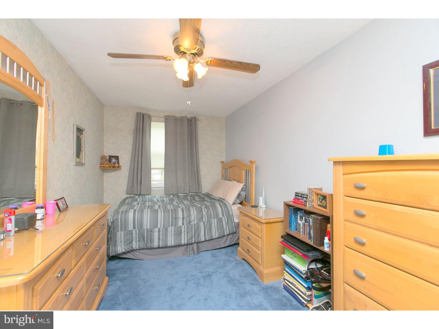 8610 Bridle Road Philadelphia, PA 19115 - Photo 16 of 25 a bedroom with a bed and a dresser