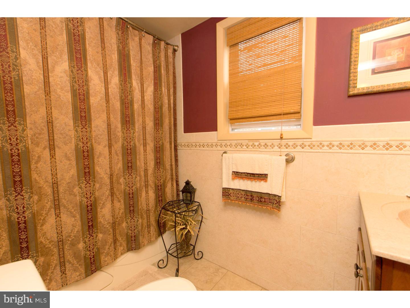 8610 Bridle Road Philadelphia, PA 19115 - Photo 18 of 25 a bathroom with a window and a shower