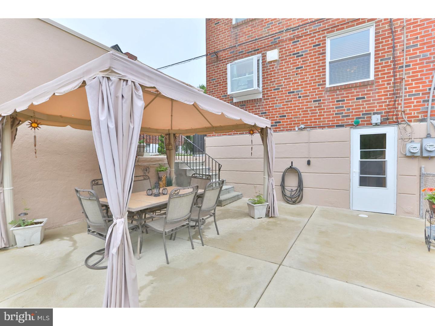 8610 Bridle Road Philadelphia, PA 19115 - Photo 21 of 25 a view of a patio with table and chairs