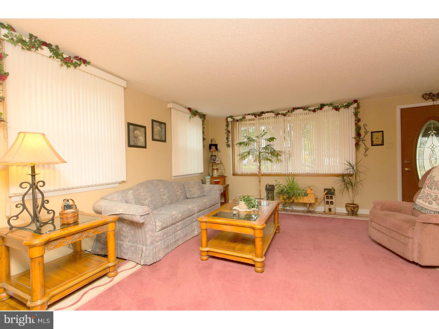 8610 Bridle Road Philadelphia, PA 19115 - Photo 7 of 25 a living room with furniture and a large window
