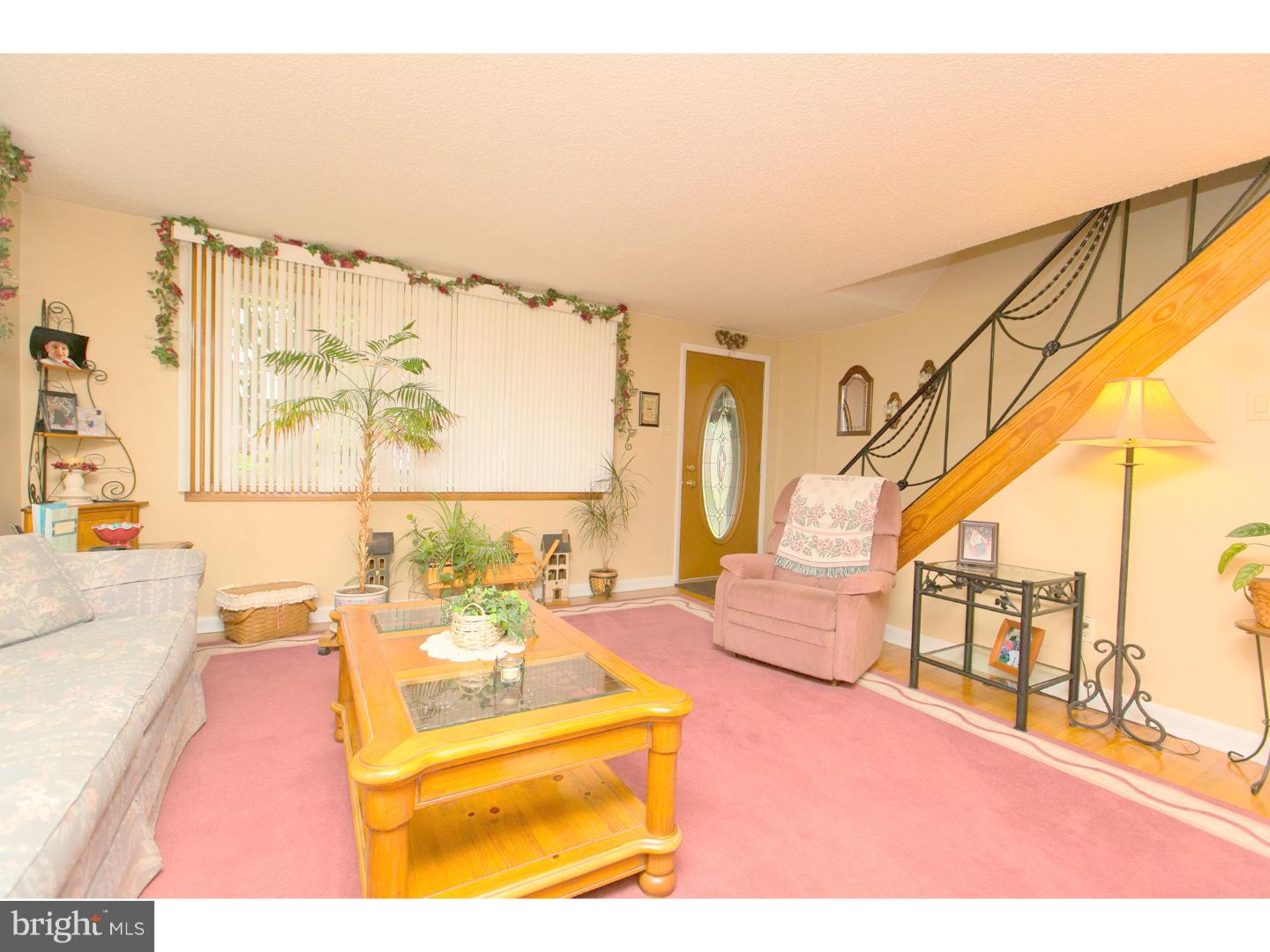 8610 Bridle Road Philadelphia, PA 19115 - Photo 8 of 25 a living room with furniture and a large window