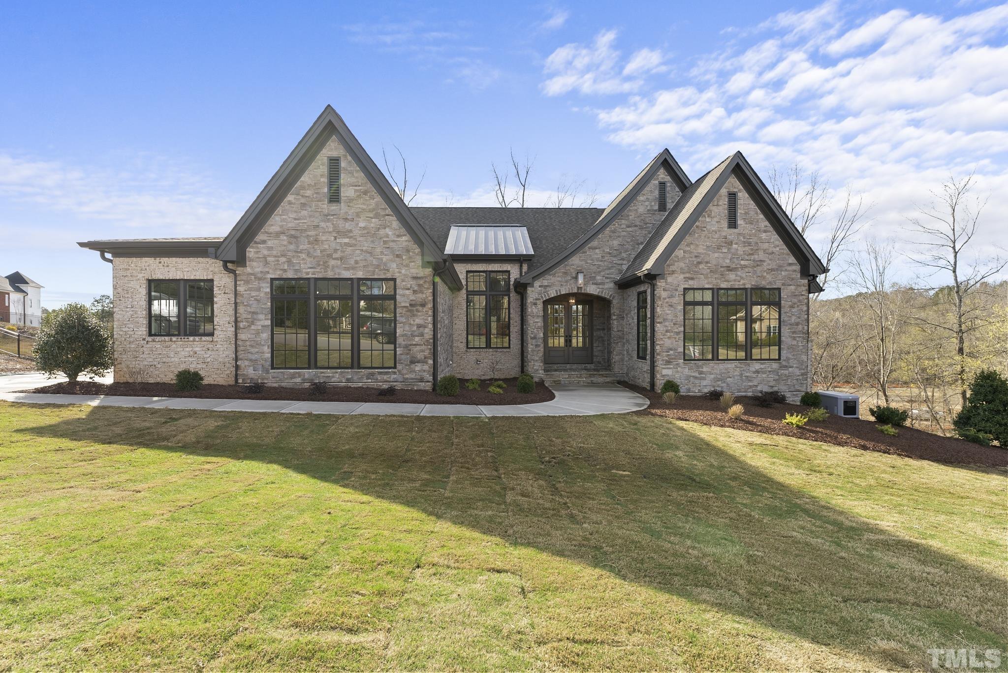4910 Poyner Road Raleigh, NC 27612 - Photo 2 of 48 a view of a house with swimming pool and a yard