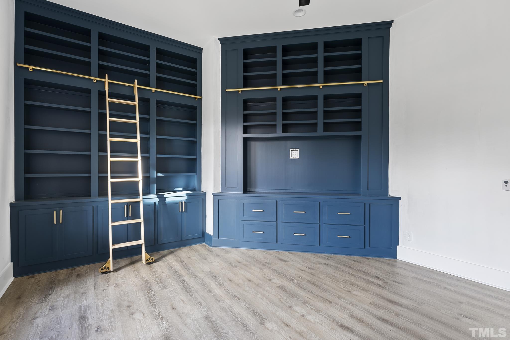 4910 Poyner Road Raleigh, NC 27612 - Photo 31 of 48 a view of an empty room with a cabinet and a window