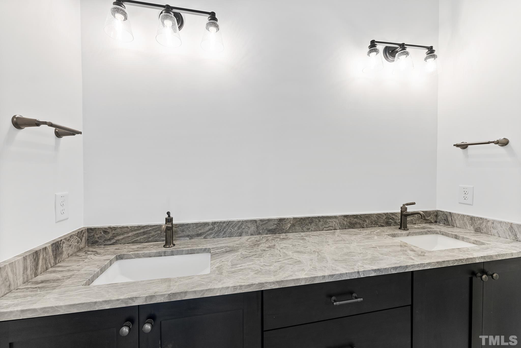 4910 Poyner Road Raleigh, NC 27612 - Photo 40 of 48 a bathroom with a granite countertop sink and a mirror