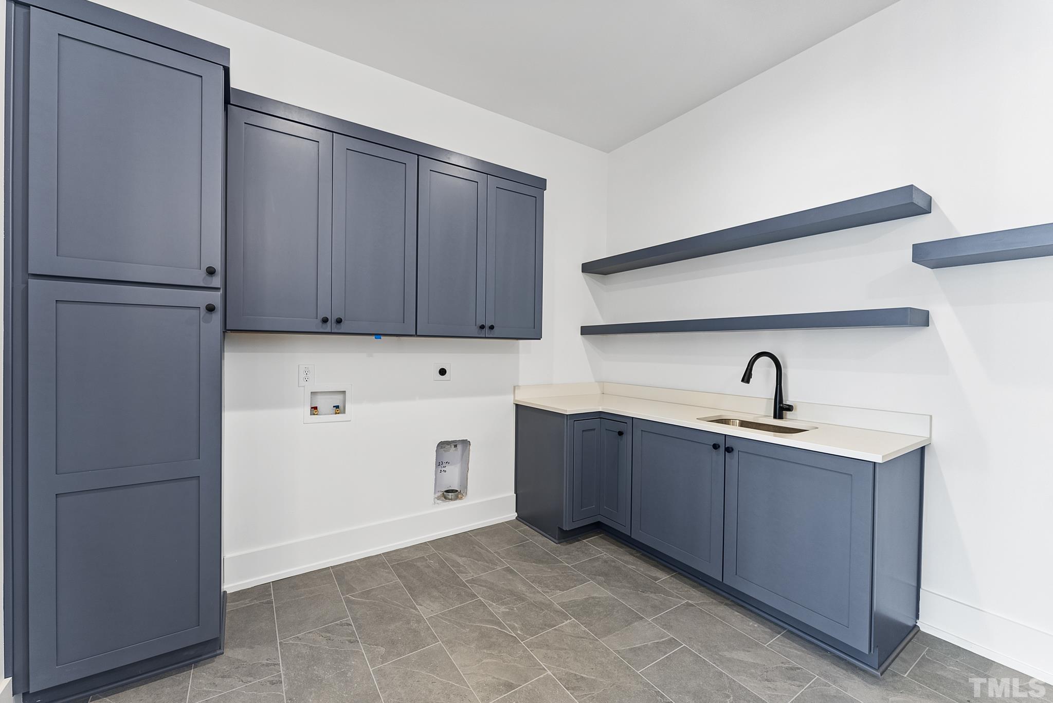 4910 Poyner Road Raleigh, NC 27612 - Photo 44 of 48 a kitchen with stainless steel appliances granite countertop a refrigerator and a sink