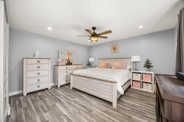 a bedroom with a bed and a table