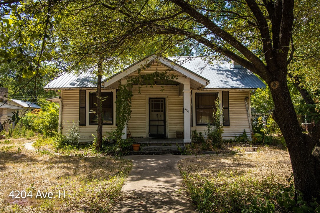 4204 Avenue H Austin, TX 78751 - Photo 1 of 1 front view of a house with a yard