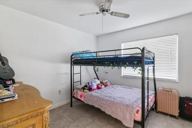 a bedroom with a bed and a desk