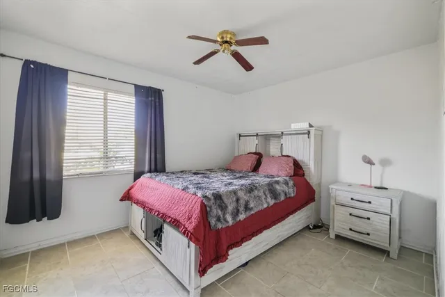 a bed room with a bed and a window