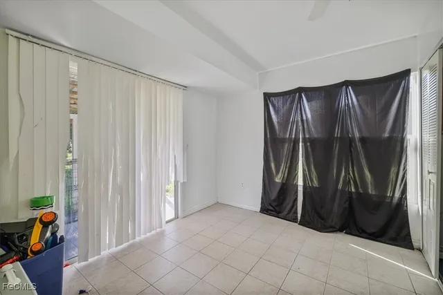 a view of walk in closet with clothes